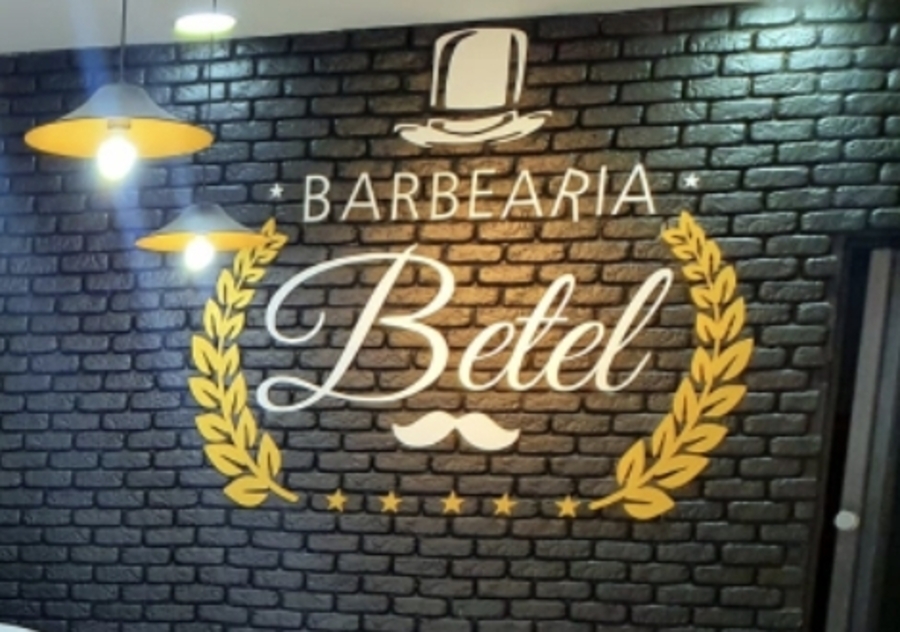 Parede com o logo da Barbearia Betel no Japuí, São Vicente